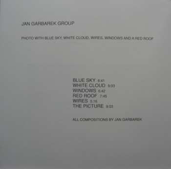 CD Jan Garbarek Group: Photo With Blue Sky, White Cloud, Wires, Windows And A Red Roof